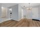Open living space with luxury vinyl flooring, bright lighting, and direct access to kitchen at 224 Aspen Cir # 224, Seminole, FL 33777
