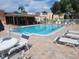 Enjoy the community pool with chairs and a covered lounge area, perfect for relaxing on a sunny day at 224 Aspen Cir # 224, Seminole, FL 33777