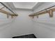 Walk-in closet with wire shelving and storage solutions for an organized wardrobe at 224 Aspen Cir # 224, Seminole, FL 33777