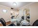 Dining area with glass table set, leading to living area and utility room at 2706 11Th Ct, Palm Harbor, FL 34684