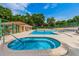 Community hot tub situated next to community pool and amenities at 2706 11Th Ct, Palm Harbor, FL 34684