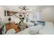 Open-concept living area with wood floors, modern furnishings, and staircase at 2706 11Th Ct, Palm Harbor, FL 34684
