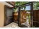 Private outdoor patio area featuring tile flooring and view of the surrounding landscape, perfect for relaxing and entertaining at 2706 11Th Ct, Palm Harbor, FL 34684