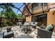 Cozy enclosed patio with tile floors, modern seating, and an inviting fire pit at 2706 11Th Ct, Palm Harbor, FL 34684