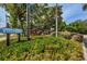 Charming Wedgewood community sign with colorful flowers enhancing the welcoming ambiance at 2706 11Th Ct, Palm Harbor, FL 34684