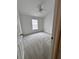 Bright bedroom with neutral carpet, ceiling fan, and window allowing natural light to illuminate the space at 27653 Pleasure Ride Loop, Wesley Chapel, FL 33544