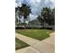 SaddleCreek community sign nestled in a well-manicured lawn with mature trees, presenting an inviting entrance at 27653 Pleasure Ride Loop, Wesley Chapel, FL 33544