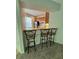 View of kitchenette featuring breakfast bar with stools, wood cabinets, and stainless steel appliances at 27653 Pleasure Ride Loop, Wesley Chapel, FL 33544