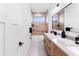 Modern bathroom featuring a double sink vanity, a tub, and a beautifully tiled shower at 3002 W Abdella St, Tampa, FL 33607