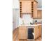 Stylish bar area with marble countertops, wine storage, and a beverage cooler integrated into the kitchen design at 3002 W Abdella St, Tampa, FL 33607