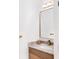 Chic powder room with elegant vanity, stylish mirror, and designer hardware at 3002 W Abdella St, Tampa, FL 33607