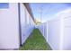 Exterior view of the side yard featuring a privacy fence and well-kept lawn at 3002 W Abdella St, Tampa, FL 33607