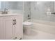 Beautiful bathroom features white cabinets, updated faucet and new lighting at 3008 E 38Th Ave, Tampa, FL 33610