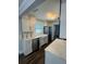 Renovated kitchen featuring bright white cabinets, stainless appliances and stone countertops at 3008 E 38Th Ave, Tampa, FL 33610