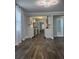 Bright living room flows to an updated kitchen and bathroom with modern finishes and fixtures at 3008 E 38Th Ave, Tampa, FL 33610