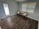 The sun room features two chairs and a door to the outside at 3008 E 38Th Ave, Tampa, FL 33610