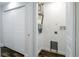 Utility room with washer hookup and white bi-fold doors at 3008 E 38Th Ave, Tampa, FL 33610
