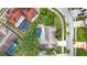 Aerial view of property featuring a large backyard, mature trees and sparkling pool with lanai at 3093 Hillside Ln, Safety Harbor, FL 34695