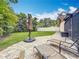 Lush backyard featuring green grass, patio, lounge chairs, and privacy fence at 3093 Hillside Ln, Safety Harbor, FL 34695