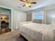 Bedroom featuring soft carpet, feather accent wall, closet, white bed, and access to another bedroom at 3093 Hillside Ln, Safety Harbor, FL 34695