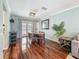 Charming dining area with hardwood floors, ample natural light, and a modern light fixture at 3093 Hillside Ln, Safety Harbor, FL 34695