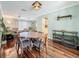 Inviting dining area with hardwood floors, stylish decor, and seamless flow to the living spaces at 3093 Hillside Ln, Safety Harbor, FL 34695