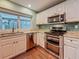 Well-equipped kitchen with stainless steel appliances, double oven, and granite countertops at 3093 Hillside Ln, Safety Harbor, FL 34695