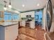 Open kitchen features stainless steel appliances and a view of the breakfast nook at 3093 Hillside Ln, Safety Harbor, FL 34695