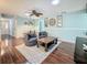 Comfortable living room with wood floors, modern furnishings, and bright, natural light at 3093 Hillside Ln, Safety Harbor, FL 34695