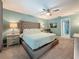 Serene main bedroom with a large bed, soft lighting, and a ceiling fan at 3093 Hillside Ln, Safety Harbor, FL 34695