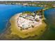 Aerial view of the coastal beach at Fred Howard Park with palm trees and clear water at 378 Wood Chuck Ave, Tarpon Springs, FL 34689