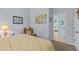 This bedroom has a chair, artwork, and doorway to another room, offering a relaxing and inviting space at 378 Wood Chuck Ave, Tarpon Springs, FL 34689