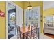 Bright dining area featuring direct access to the outdoor patio, perfect for entertaining Gathering and friends at 378 Wood Chuck Ave, Tarpon Springs, FL 34689