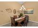 Cozy dining room with modern chandelier and stylish decor, perfect for entertaining guests at 378 Wood Chuck Ave, Tarpon Springs, FL 34689