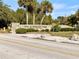 Daytime view of Fred H. Howard Park entrance sign along a paved road with trees at 378 Wood Chuck Ave, Tarpon Springs, FL 34689