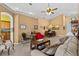 Inviting living room featuring neutral tones, carpet flooring, and elegant furnishings for comfortable living and entertaining at 378 Wood Chuck Ave, Tarpon Springs, FL 34689