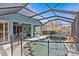 Screened pool with spa and patio area, perfect for outdoor entertaining at 378 Wood Chuck Ave, Tarpon Springs, FL 34689