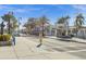 Shops and Restaurants lining a walkable neighborhood with street lamps and a statue at 378 Wood Chuck Ave, Tarpon Springs, FL 34689