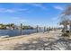 A waterfront neighborhood with a concrete pier and nearby shops and restaurants at 378 Wood Chuck Ave, Tarpon Springs, FL 34689