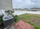 Backyard with AC and vinyl fence at 3810 Romano Busciglio St, Tampa, FL 33619