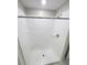 Bathroom featuring a stand-up shower with glass door and white tiles at 3810 Romano Busciglio St, Tampa, FL 33619