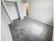 Spacious bedroom featuring neutral paint, gray carpet, and a closet with ample storage space at 3810 Romano Busciglio St, Tampa, FL 33619