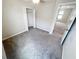 Bedroom showcasing neutral paint, gray carpet, closet, and natural light at 3810 Romano Busciglio St, Tampa, FL 33619