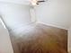 Spacious bedroom with neutral walls and carpeting, complemented by a ceiling fan at 3810 Romano Busciglio St, Tampa, FL 33619