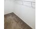 Walk-in closet with carpet and white shelving and trim at 3810 Romano Busciglio St, Tampa, FL 33619