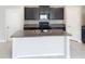 Kitchen island with granite countertops and stainless steel sink at 3810 Romano Busciglio St, Tampa, FL 33619