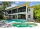 Backyard with multi-level patio featuring a pool and spa at 4313 W Beachway Dr, Tampa, FL 33609