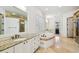 Luxurious bathroom with granite countertops, a soaking tub, and a separate glass-enclosed shower at 4313 W Beachway Dr, Tampa, FL 33609