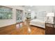 Spacious bedroom filled with natural light features hardwood flooring and multiple windows overlooking outdoor scenery at 4313 W Beachway Dr, Tampa, FL 33609