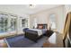 Inviting bedroom with neutral walls, a large window, and stylish decor with an area rug at 4313 W Beachway Dr, Tampa, FL 33609